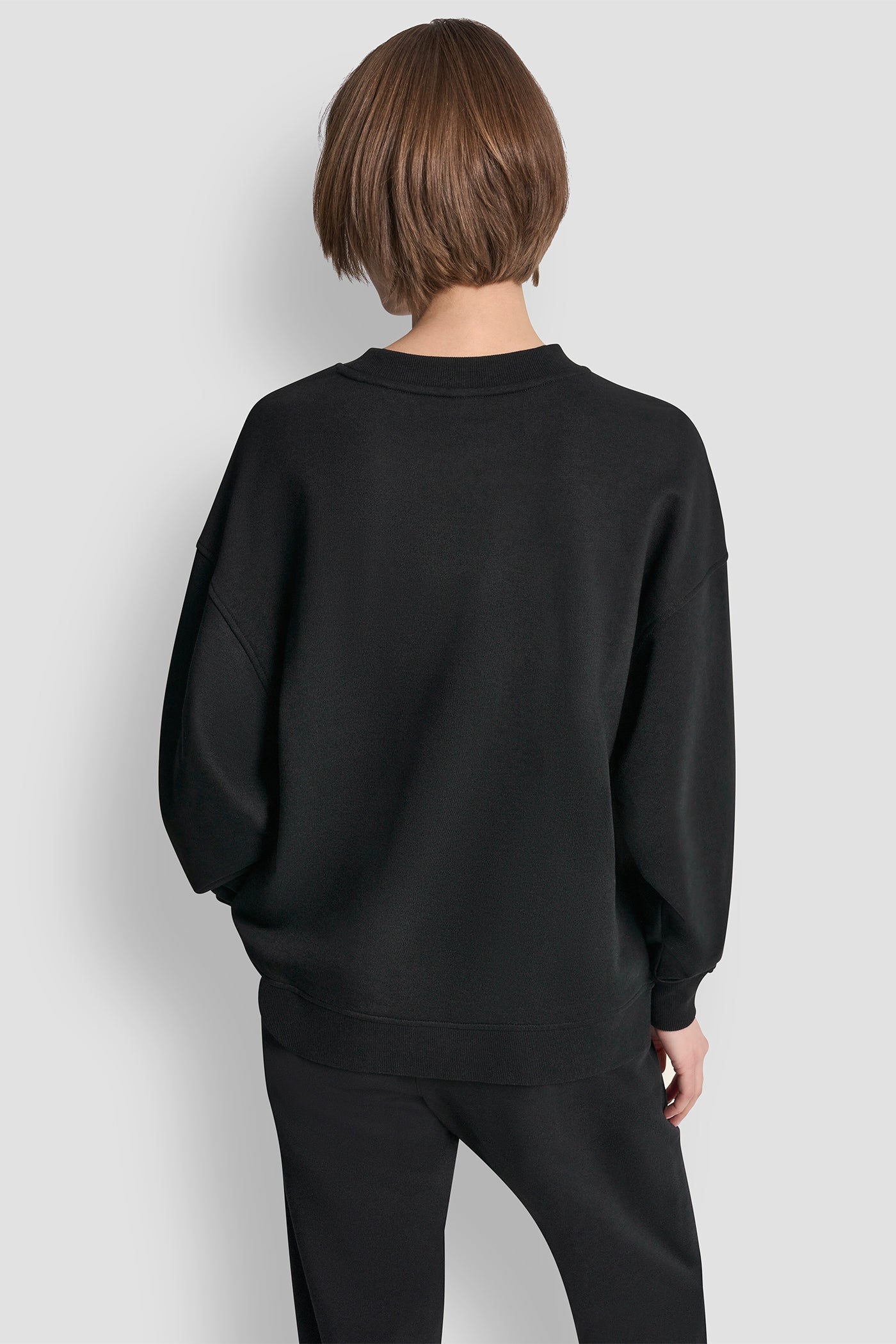 سترة بشعار DKNY كوليجييت ميداليون
