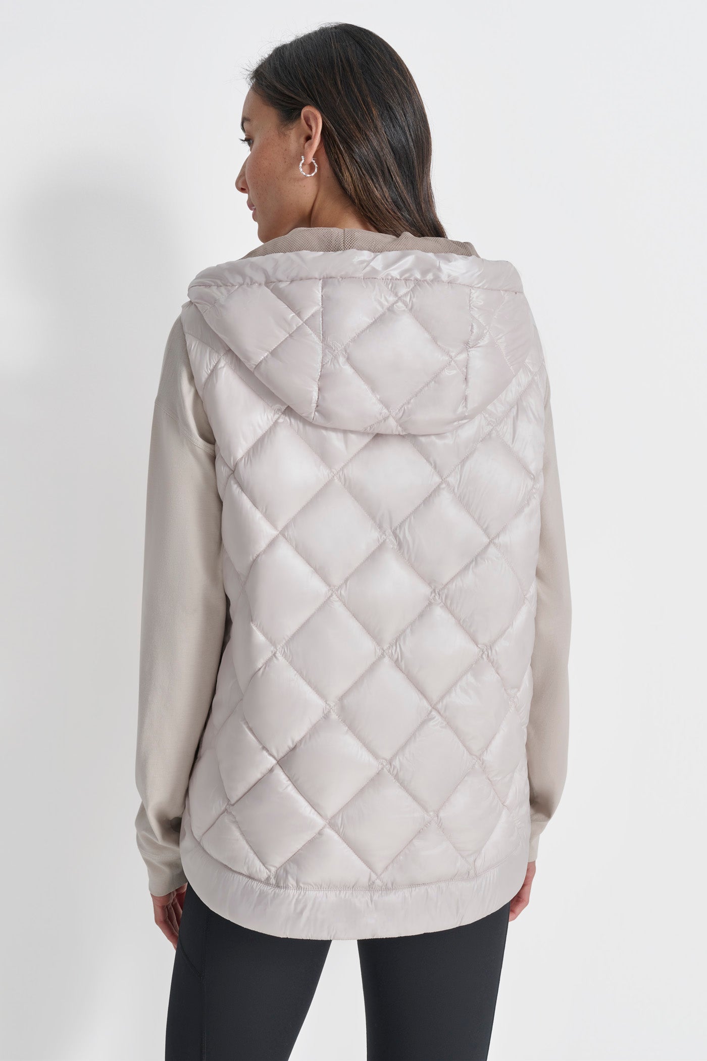 SLEEVELESS QUILTED CURVED HEM PUFFER VEST WITH HOOD