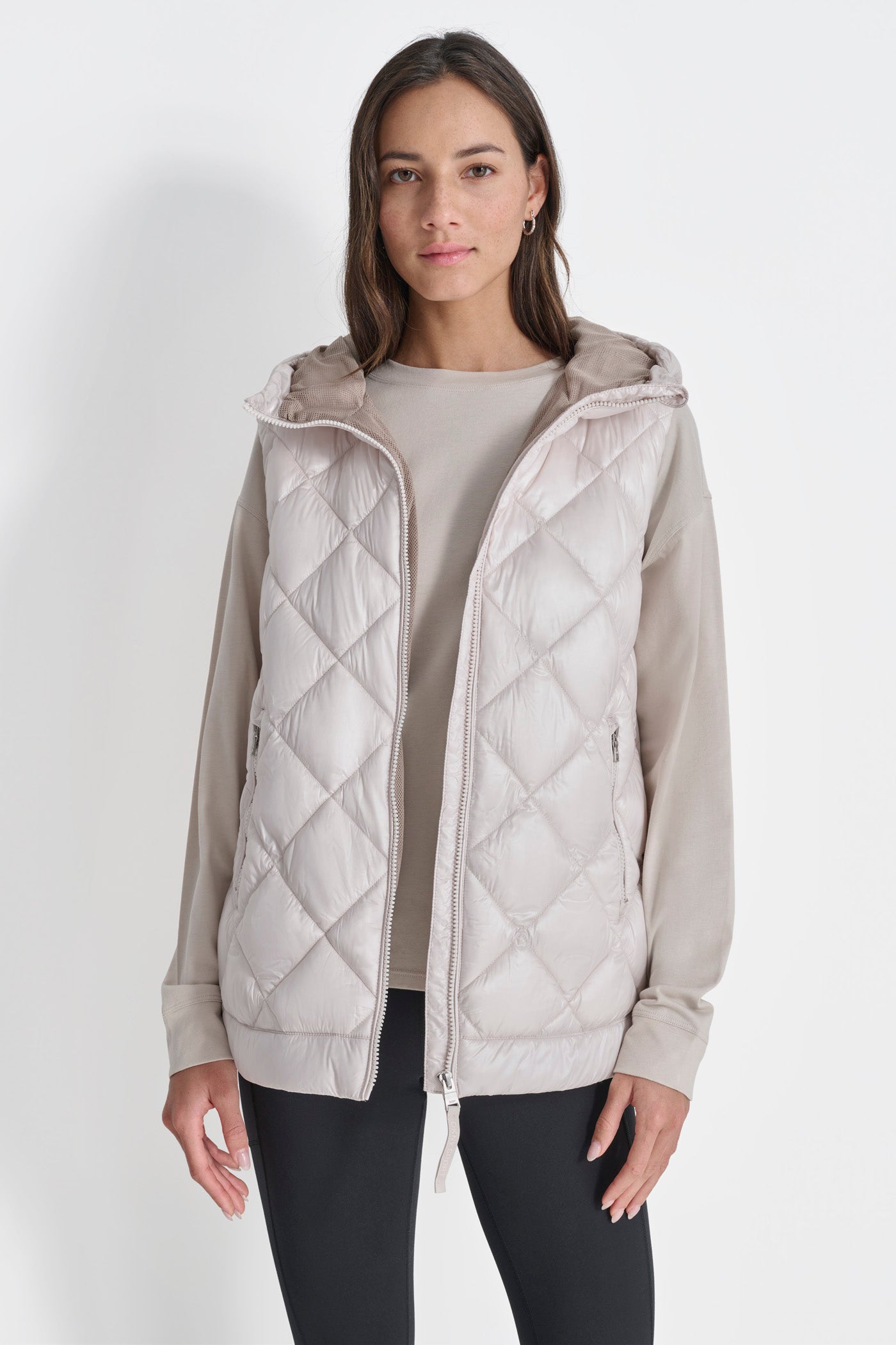 SLEEVELESS QUILTED CURVED HEM PUFFER VEST WITH HOOD